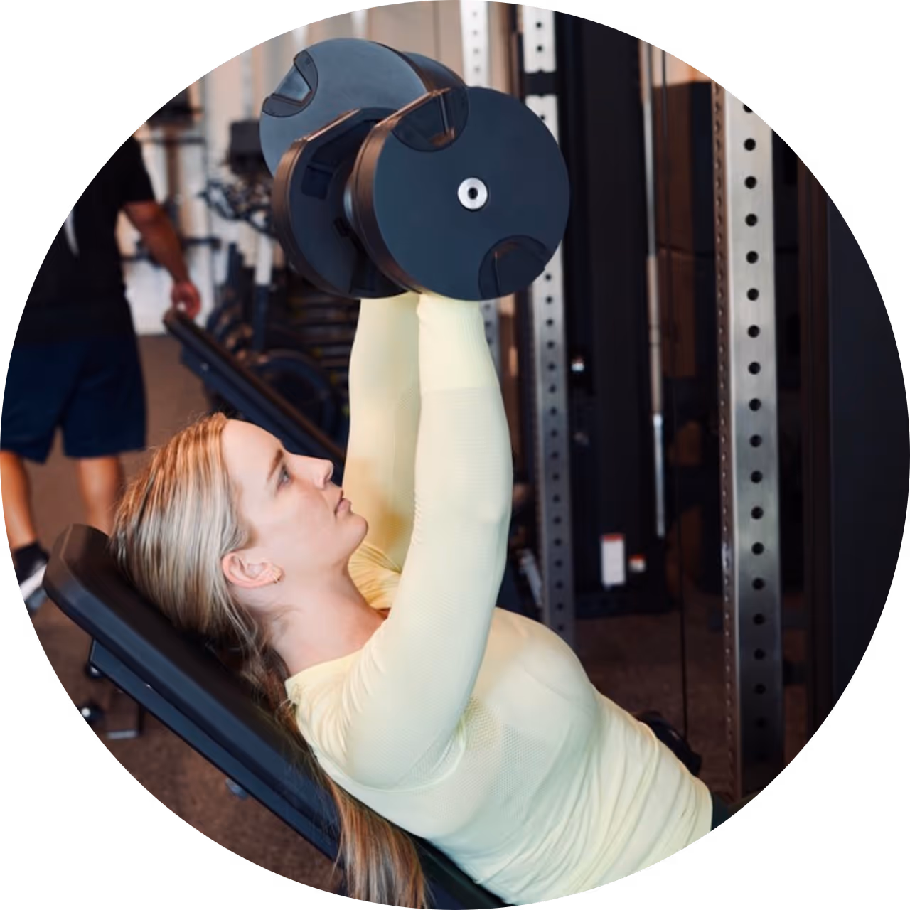proof3 salt river member, Maggie, doing dumbbell incline bench press in proof3 salt river's gym